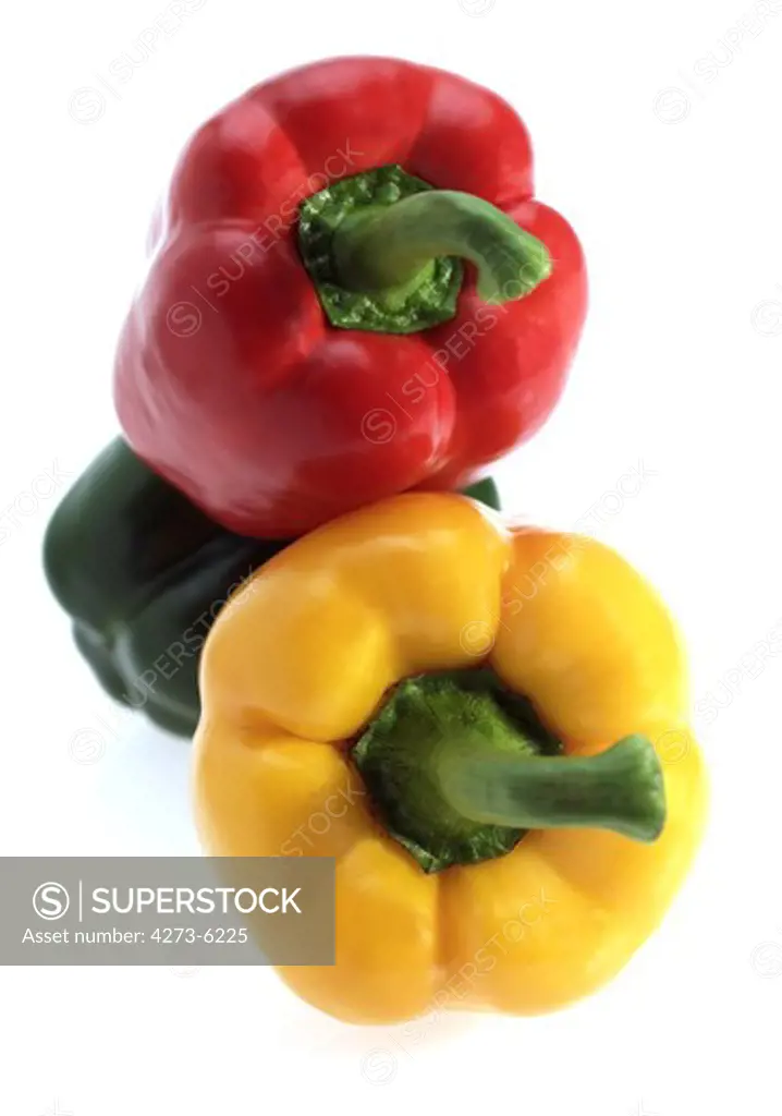 Red Yellow And Green Sweet Pepper, Capsicum Annuum, Against White Background