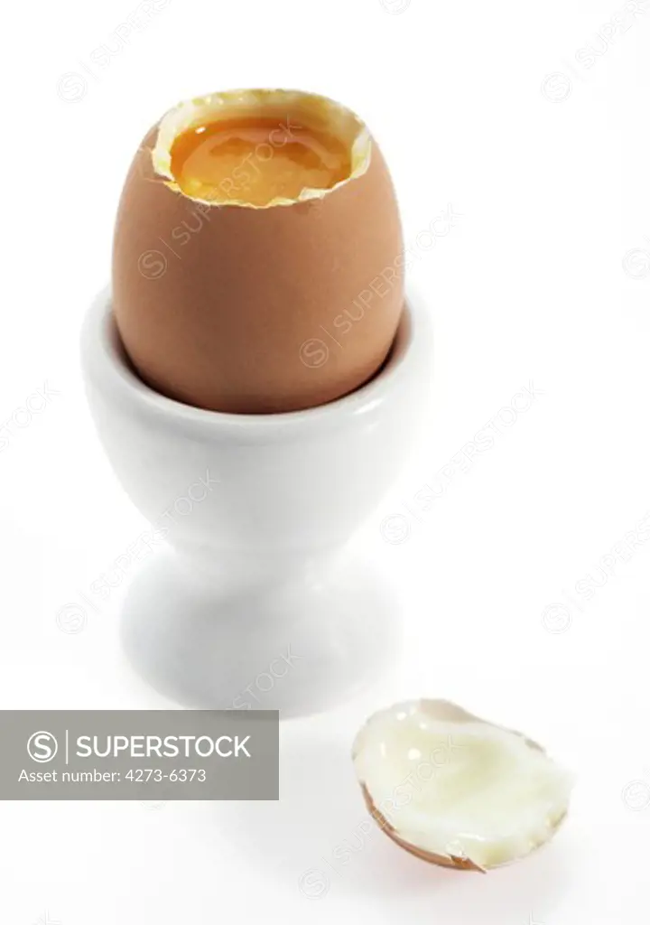 Soft-Boiled Egg With Egg Cup Against White Background