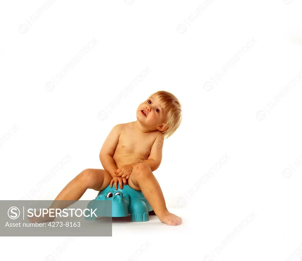 Child On Potty Against White Background