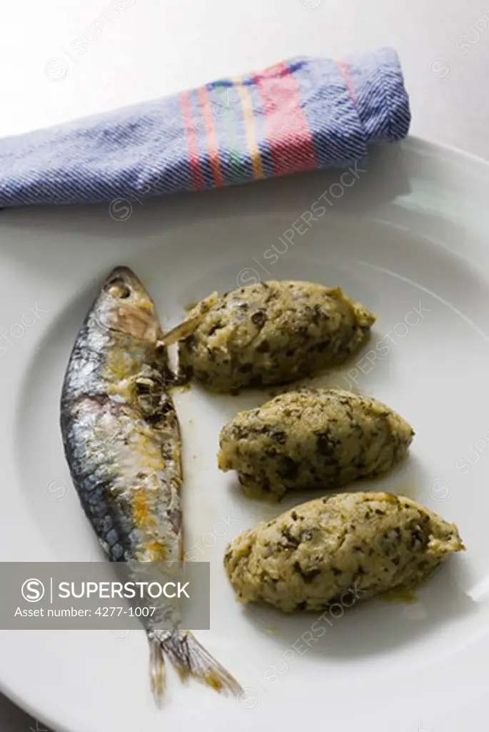 Trinxat de la Cerdanya arranged on plate with sardine