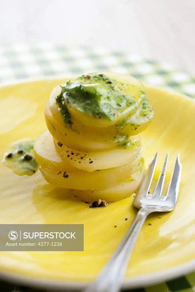 Watercress butter on sliced potatoes