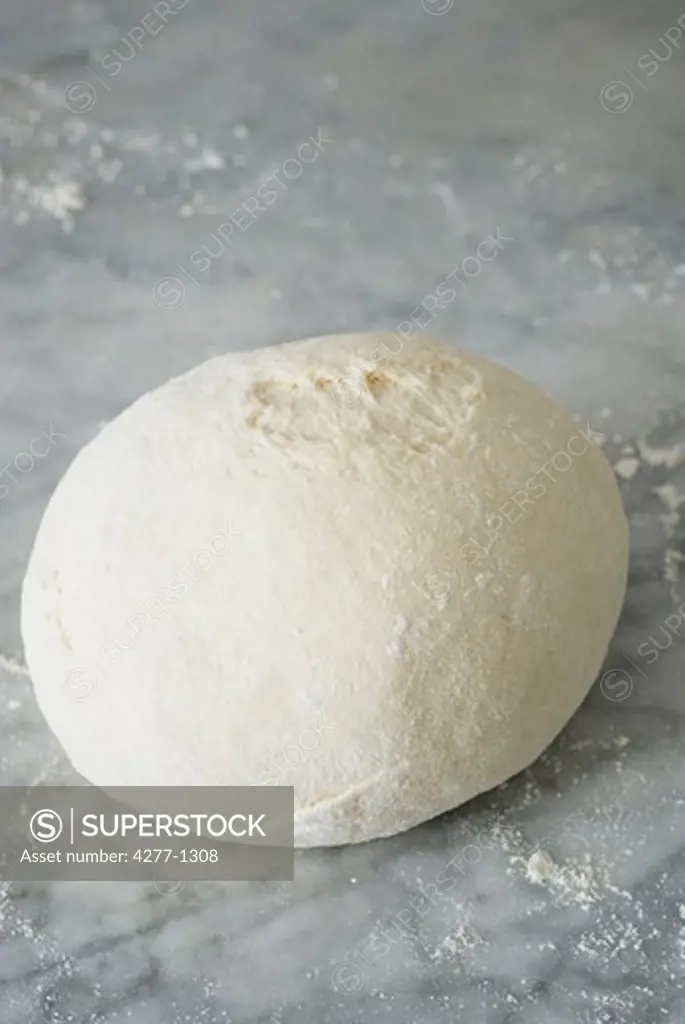 Basic bread dough formed into ball and dusted with flour