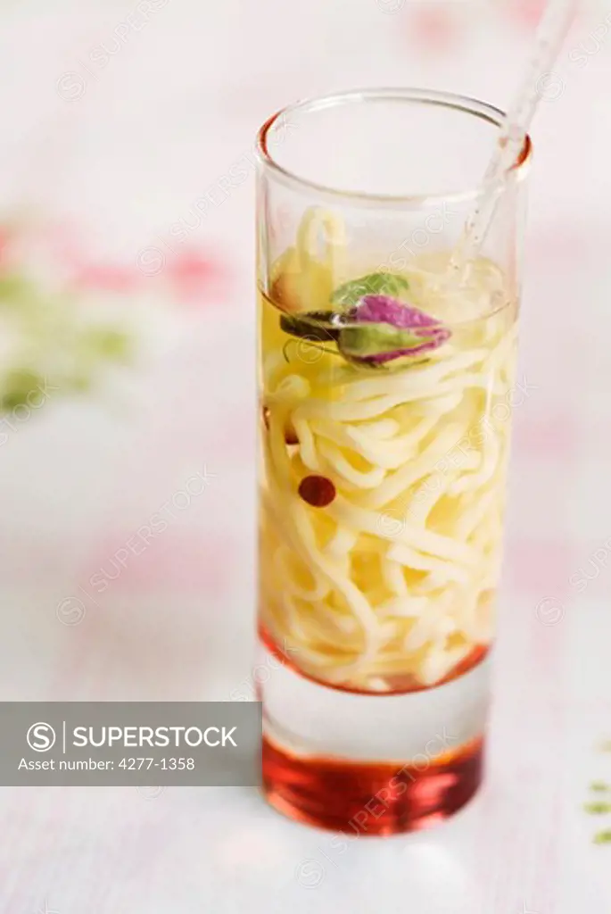 Chicken and rose soup with spaghettini