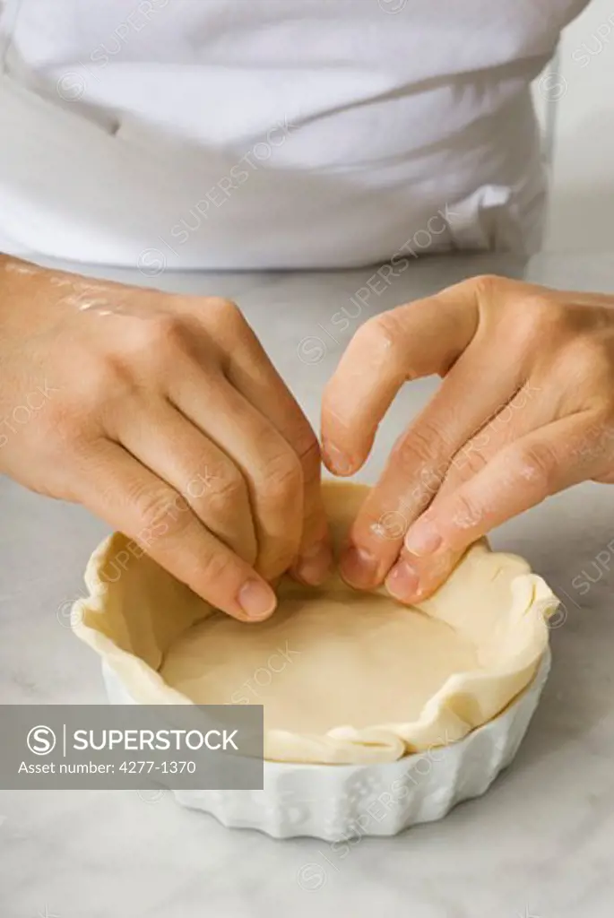 Preparing pastry dough for tart