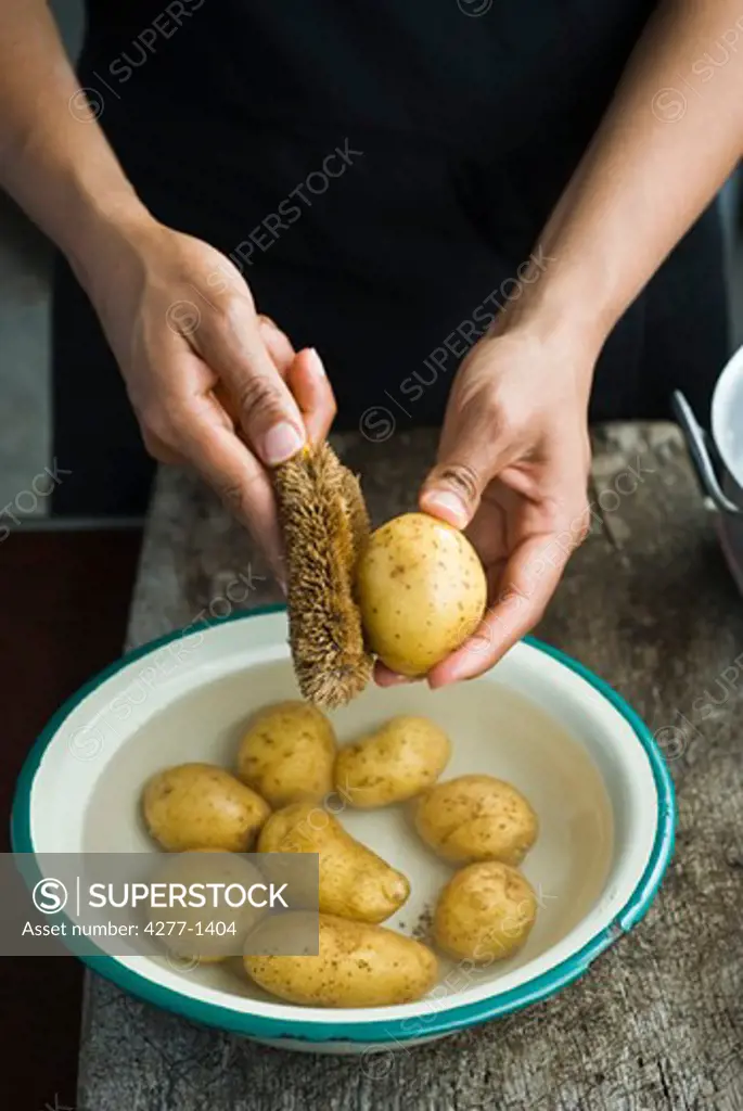 Scrubbing baby potatoes