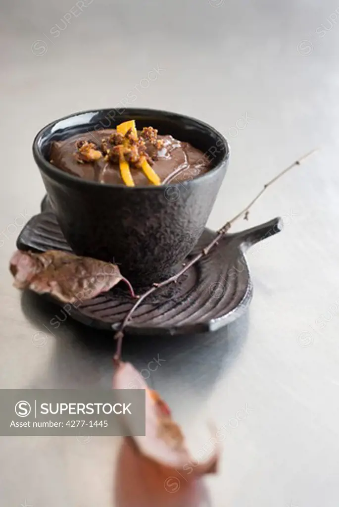 Chocolate mousse topped with caramelized hazelnuts and orange zest
