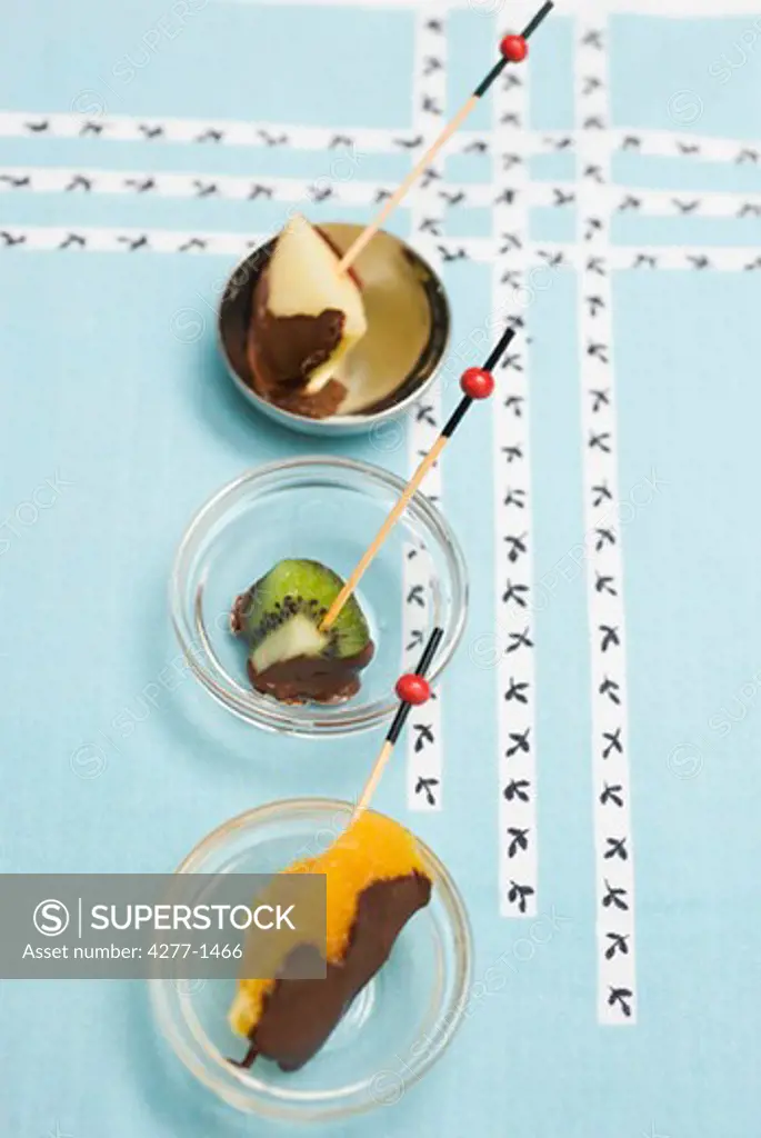 Three chocolate fondue with fruit