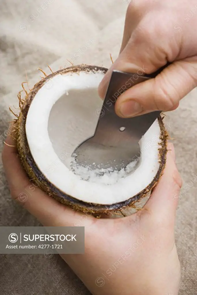 Grating coconut meat