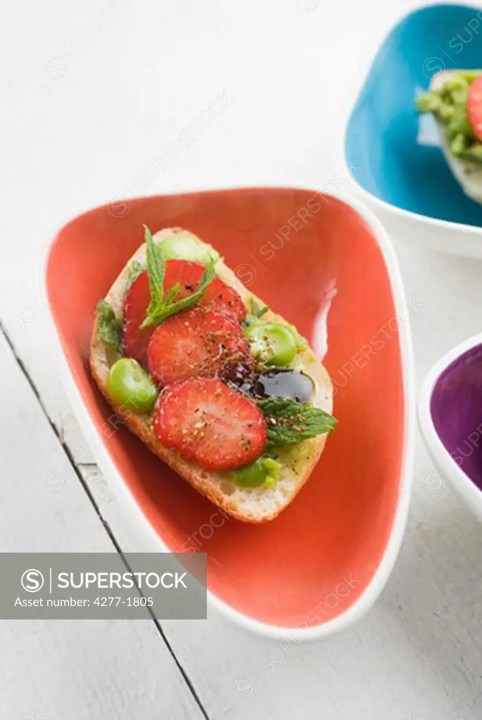Broad bean and strawberry toasts