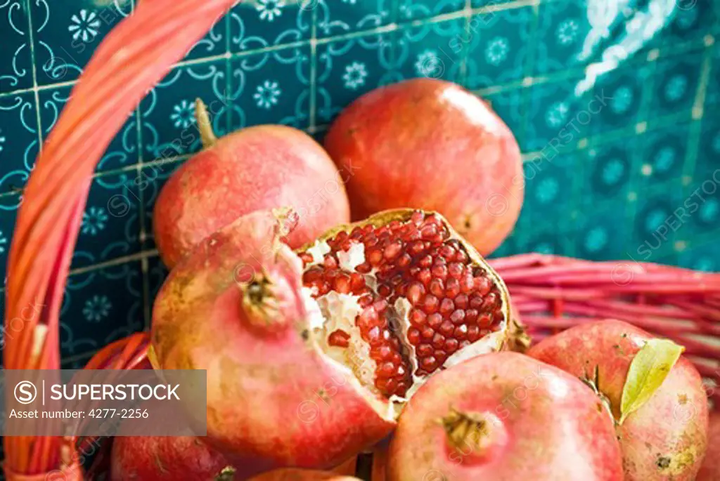 Fresh pomegranates in basket