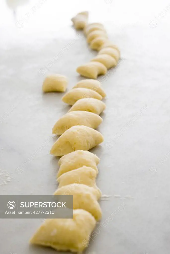Fresh gnocchi dough cut into small pieces