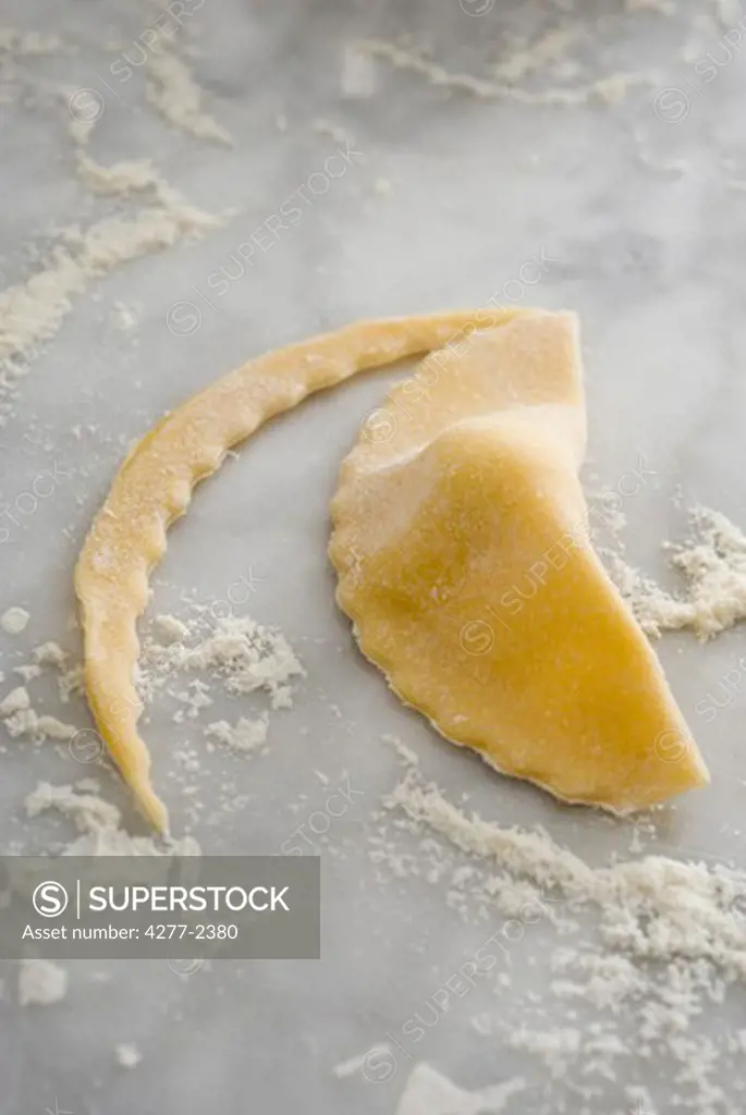 Ricotta turnover, trimming the sealed dough edge