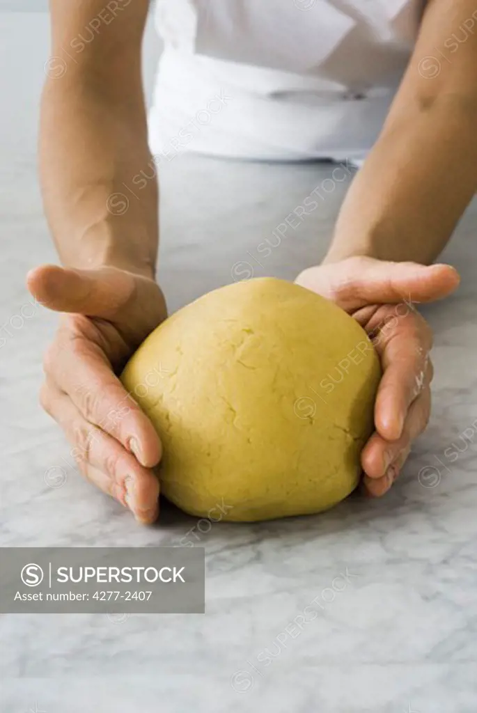 Forming fresh dough into ball