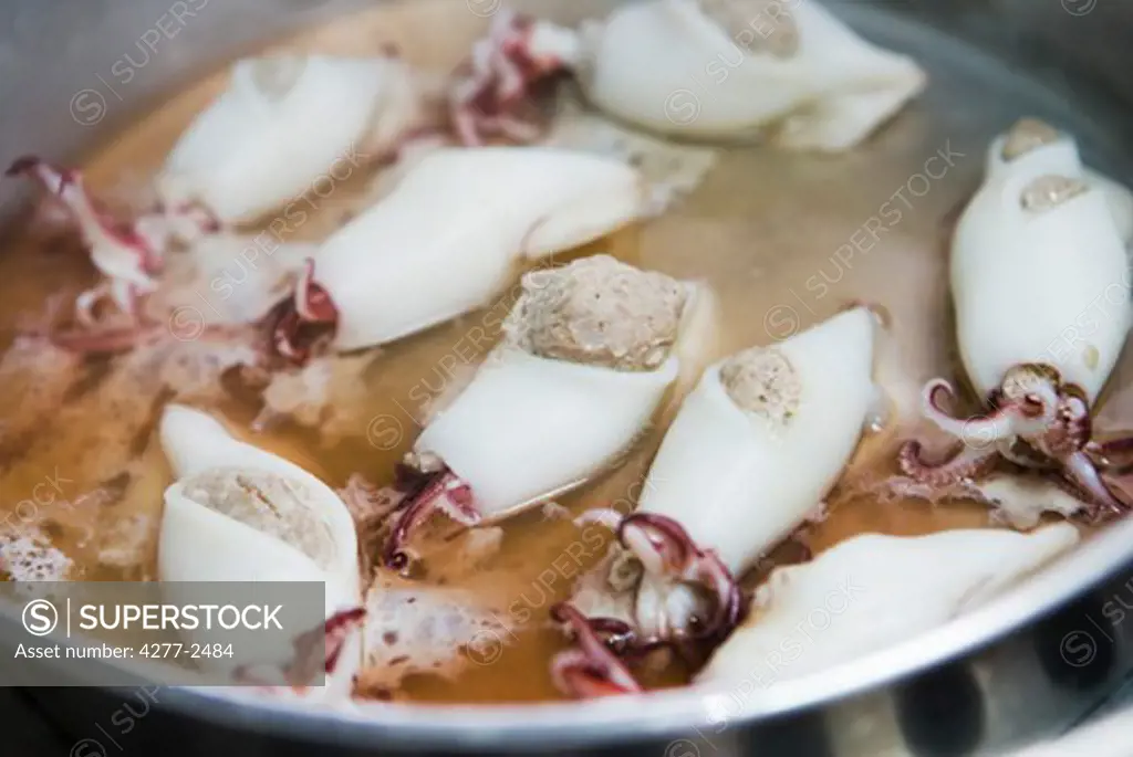 Steaming pork-stuffed calamari