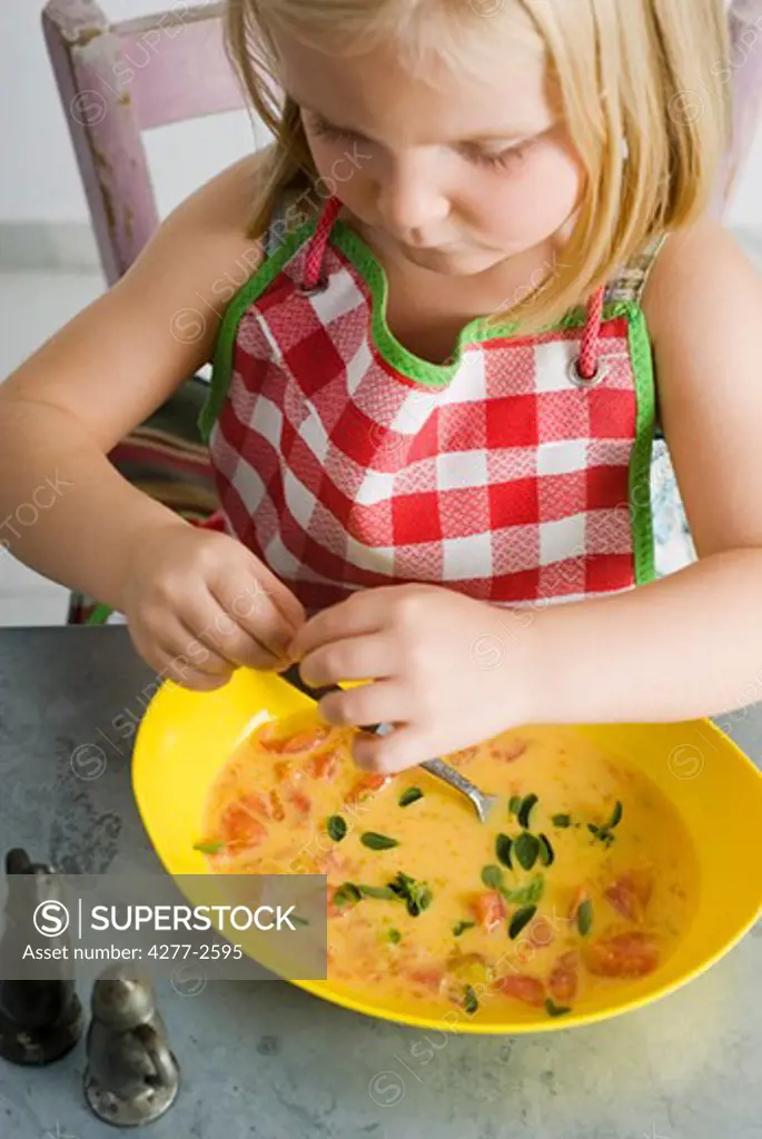 Little girl preparing food