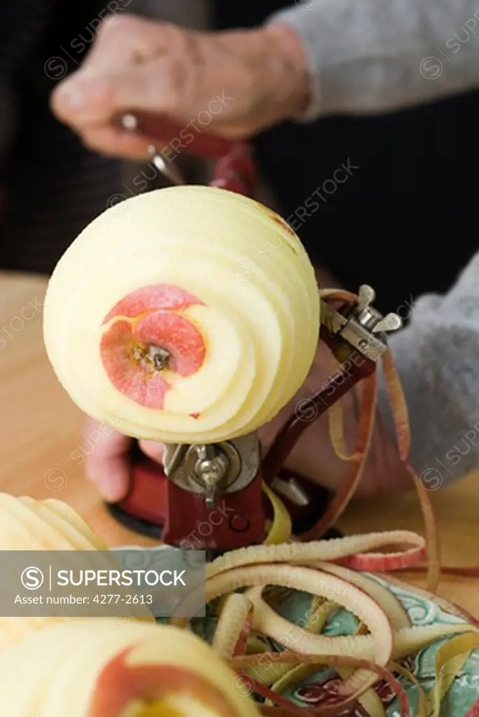 Peeling apple with apple peeler