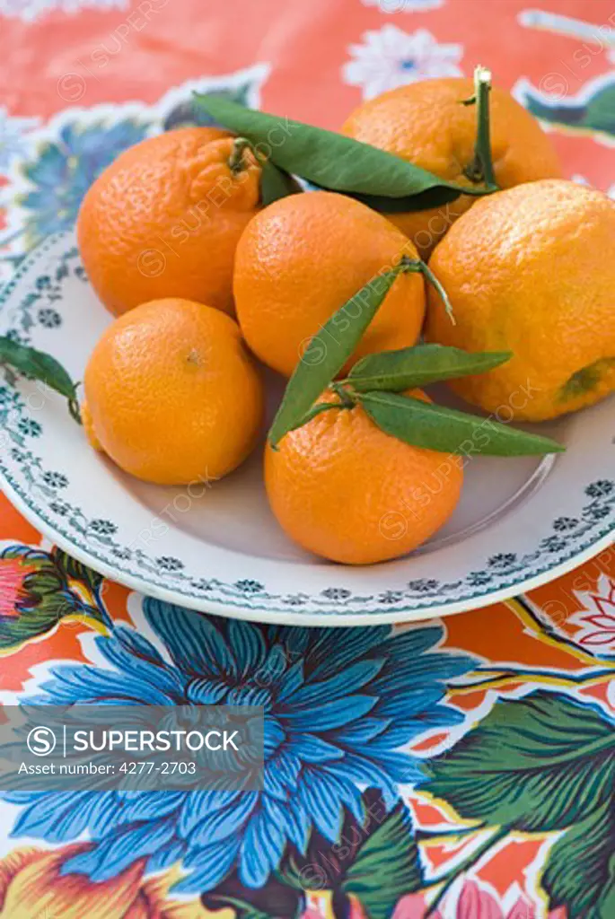 Fresh oranges on plate