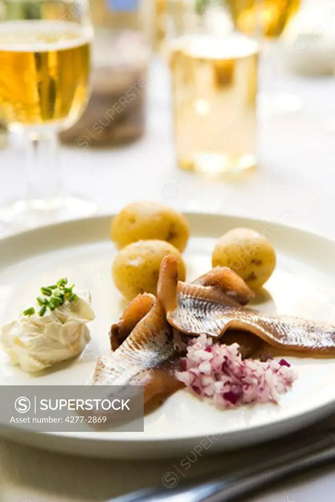 Pickled herring, new potatoes with sour cream