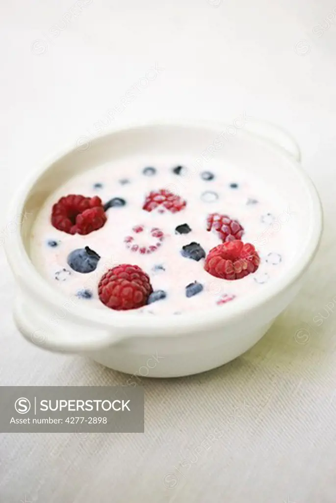 Raspberries and blueberries with cream