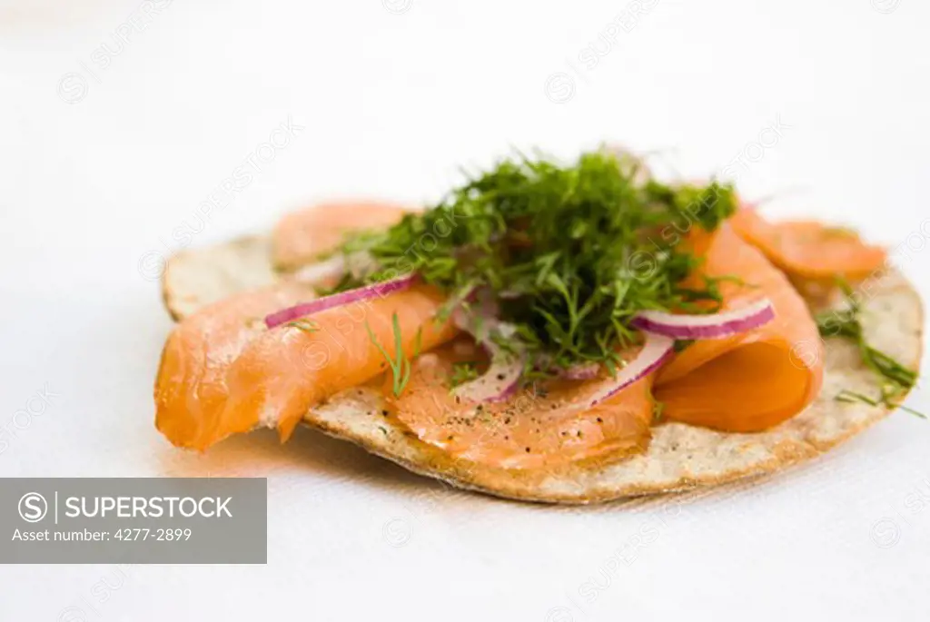 Crisp bread topped with smoked salmon and fresh dill