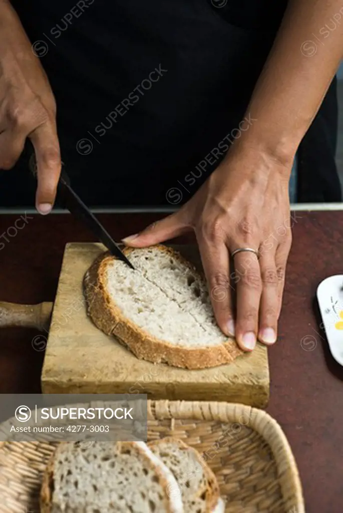 Cutting slice of bread in half