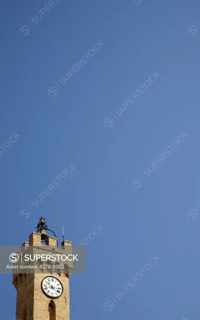 Clock tower against cloudless blue sky