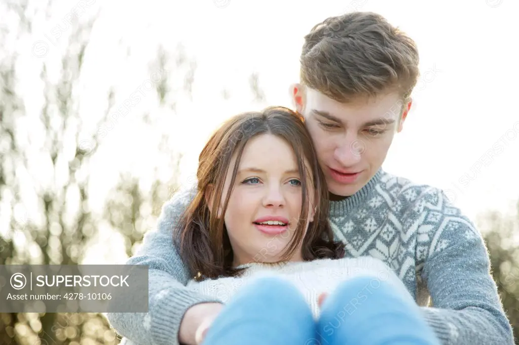 Young Couple Hugging Outdoors