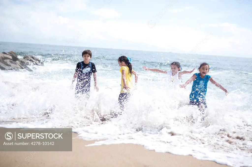 Children Playing in Sea Water