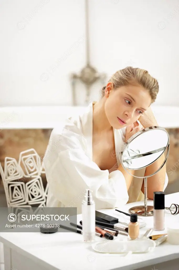 Woman at Dressing Table Looking in Mirror