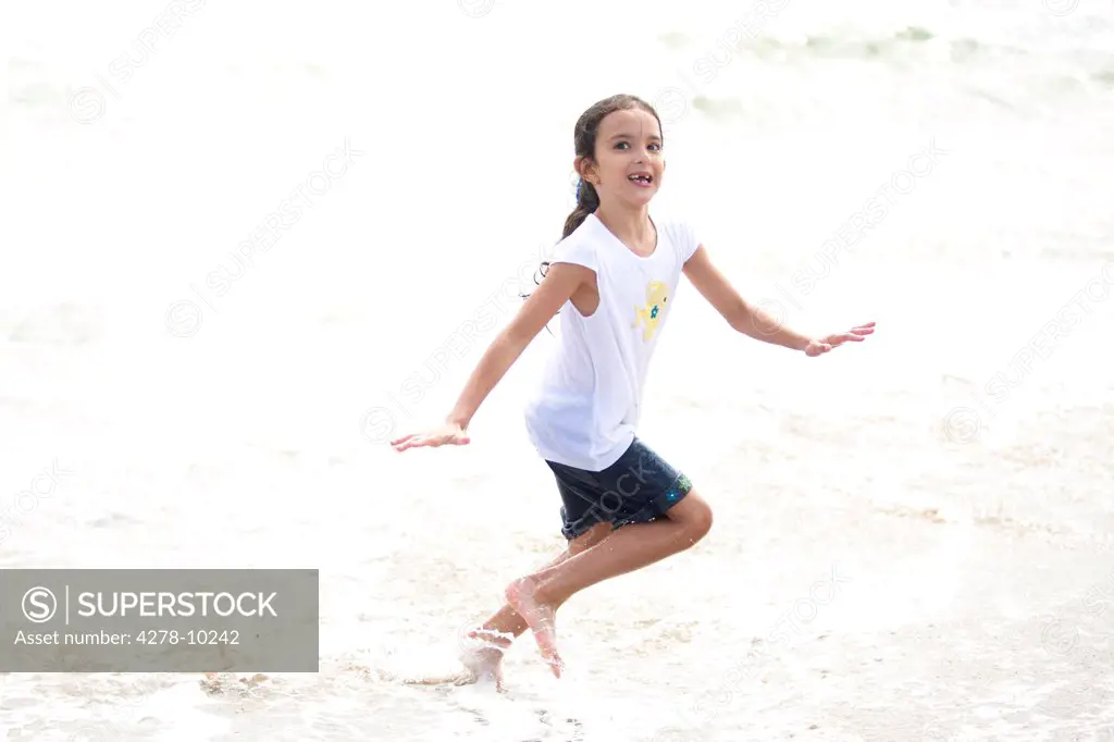 Girl Running in Sea Water