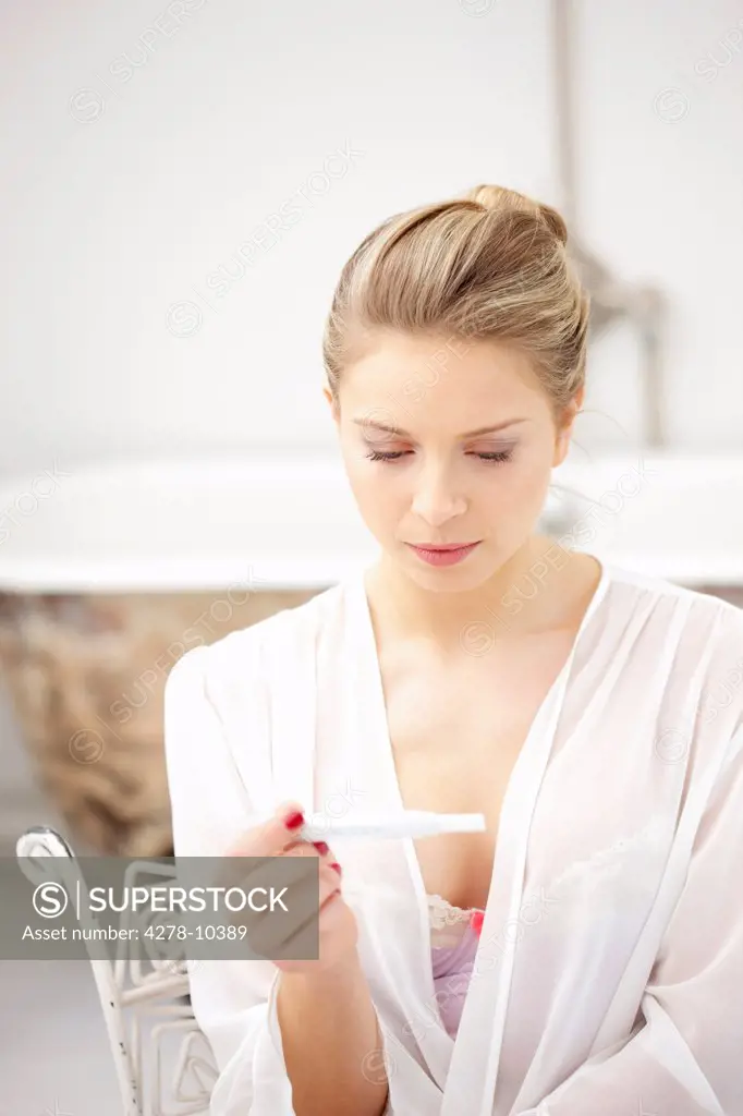 Woman Reading Pregnancy Test