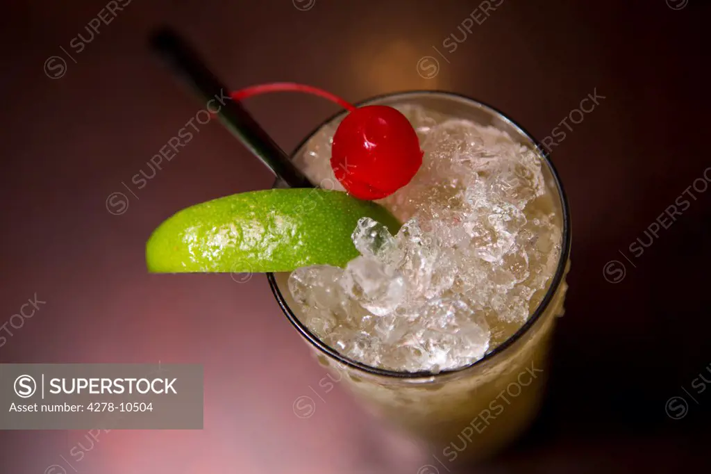 Cocktail with Crushed Ice, Lime and Candied Cherry