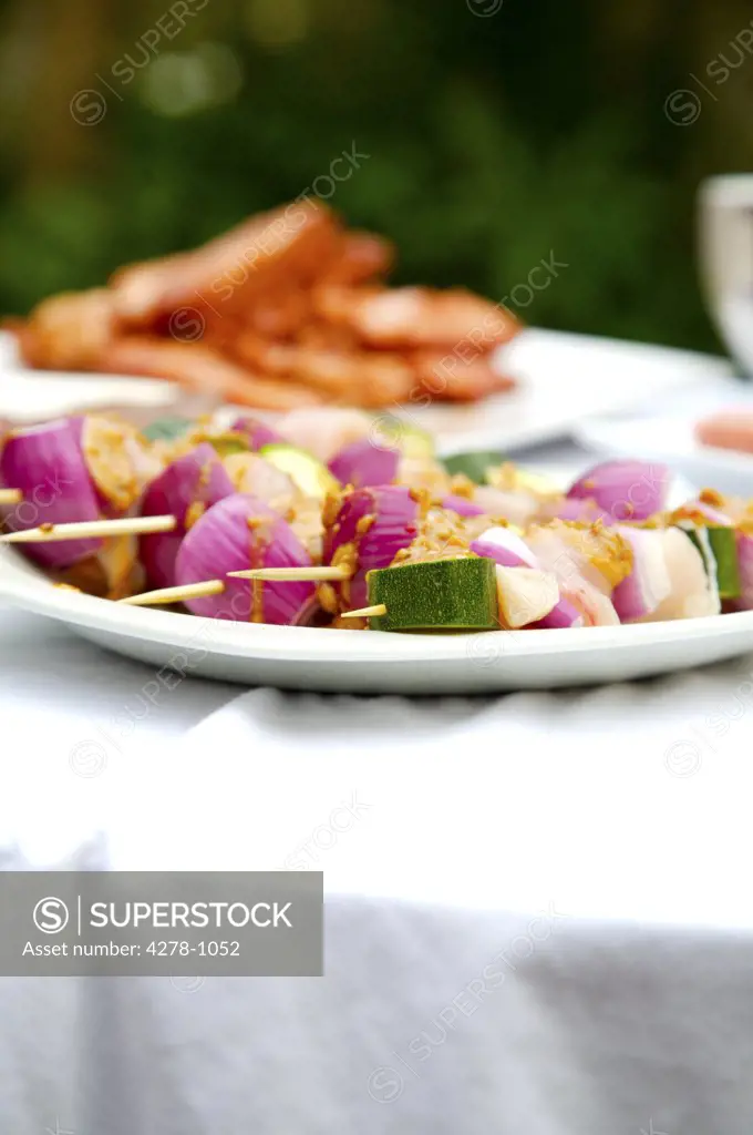 Close up of barbeque platter of food on garden table