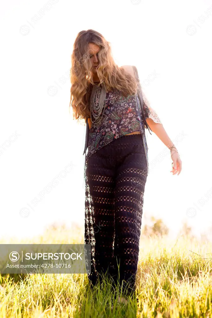 Woman Walking in Field