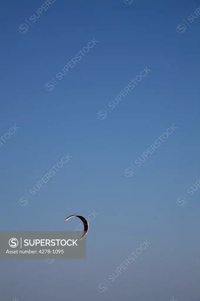 Kite for kite surfing against blue sky