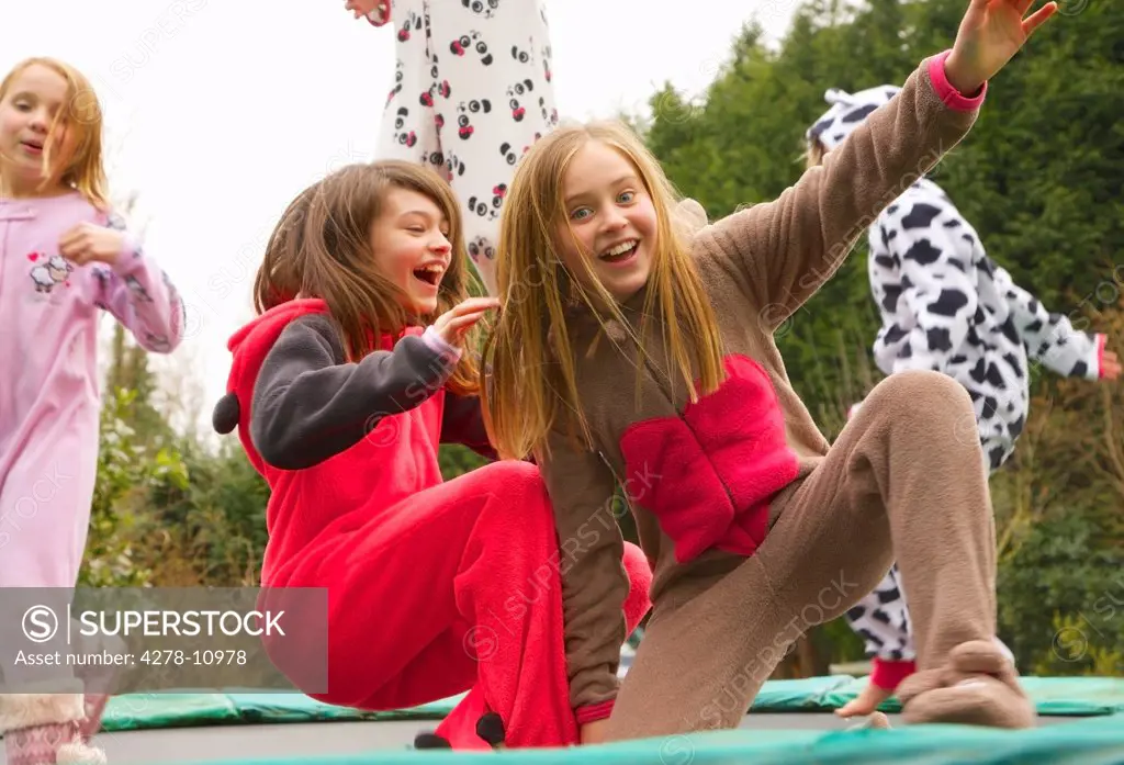 Group of Girls Wearing Animal Costumes on Trampoline