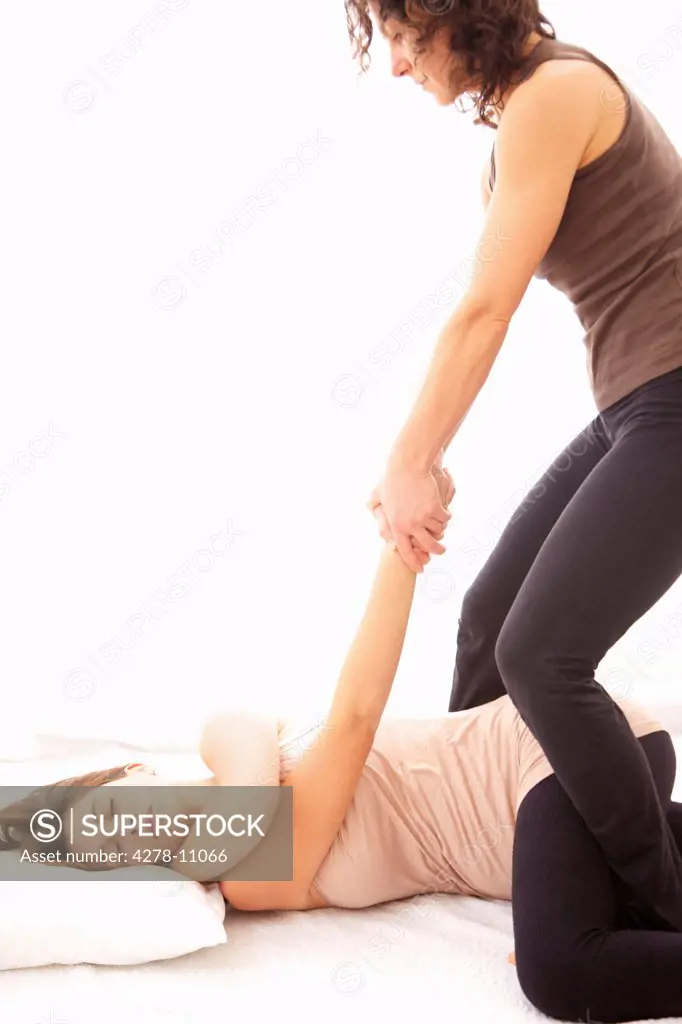 Woman Receiving a Thai Yoga Massage
