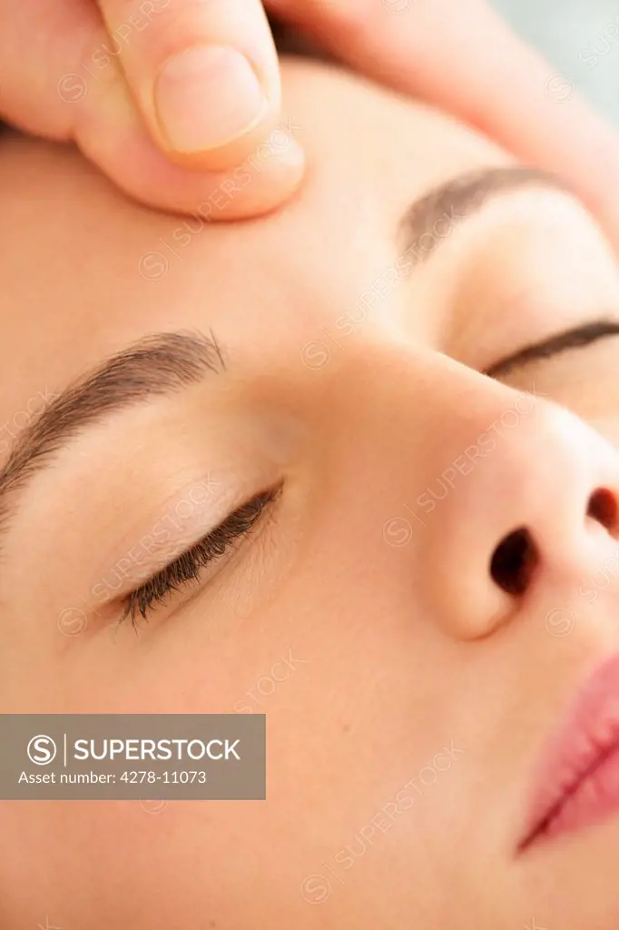 Woman Receiving a Facial Massage, Close-up View