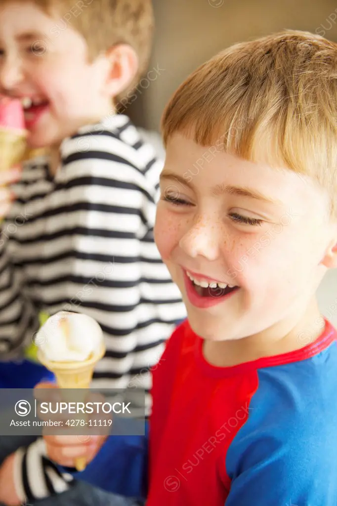 Two Young Boys Eating Ice Cream