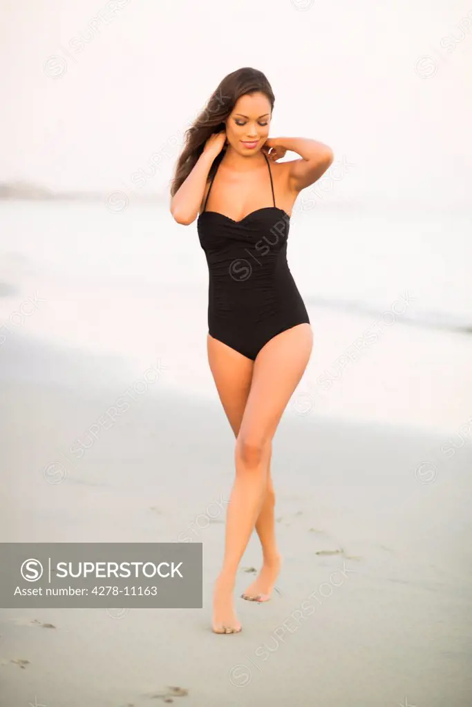 Attractive Woman Walking on Beach