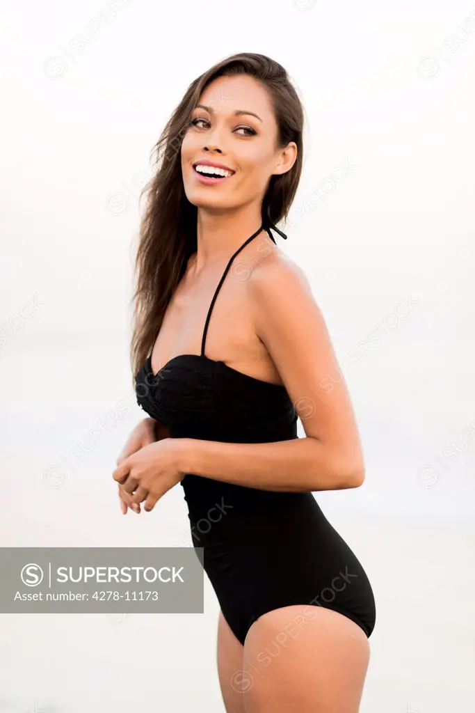 Smiling Woman Wearing Black Swimsuit