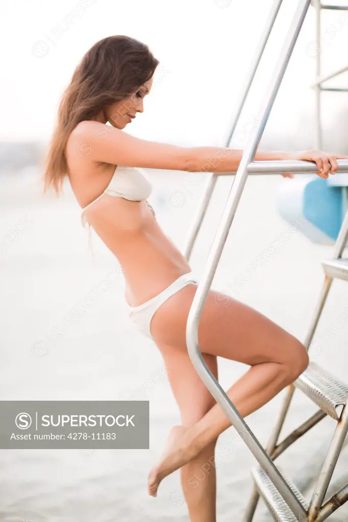 Woman Wearing Bikini Climbing Steps