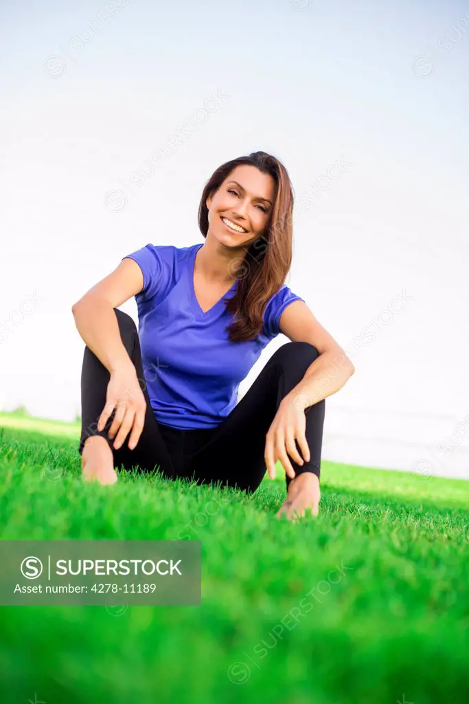 Woman Sitting on Grass