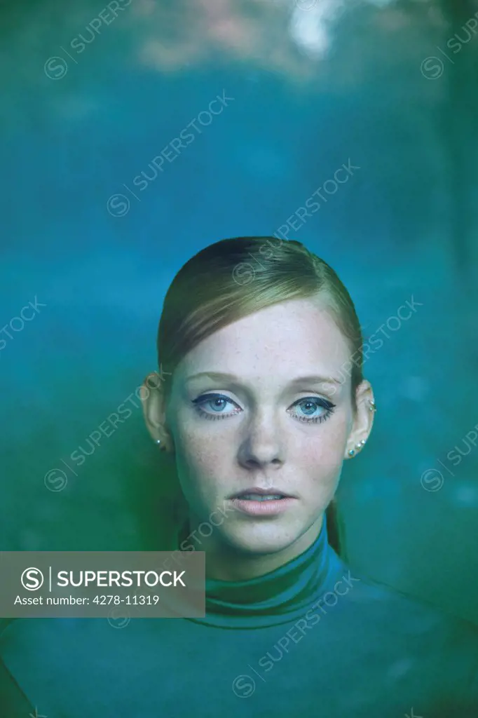 Portrait of Young Woman behind Pane of Glass