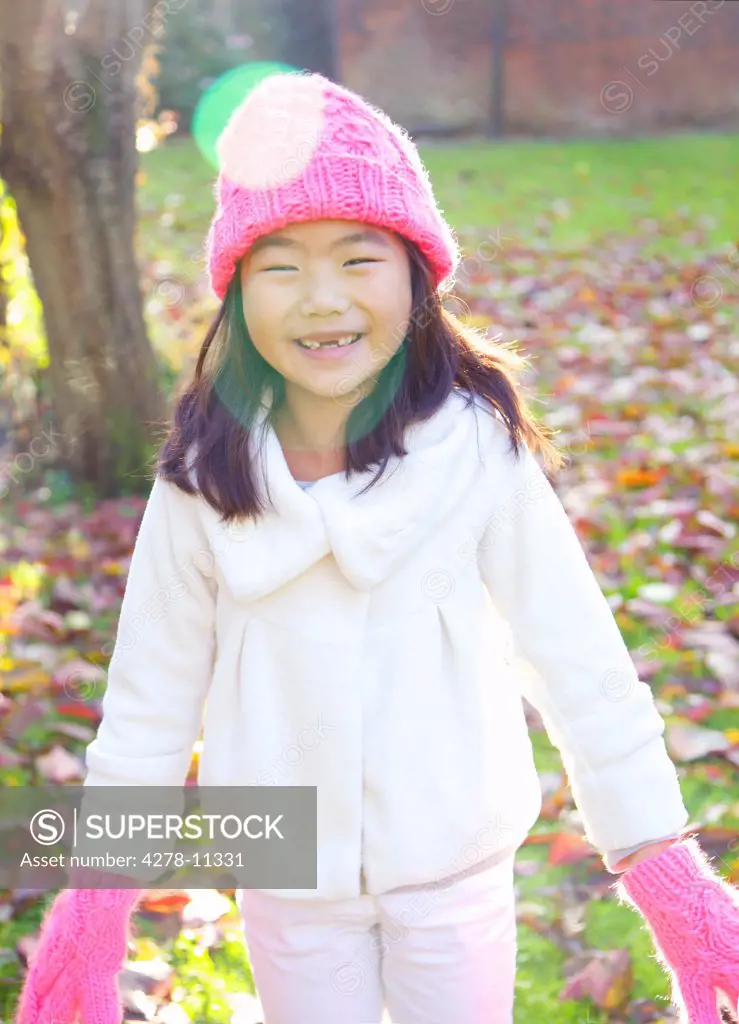 Smiling Young Girl In Park
