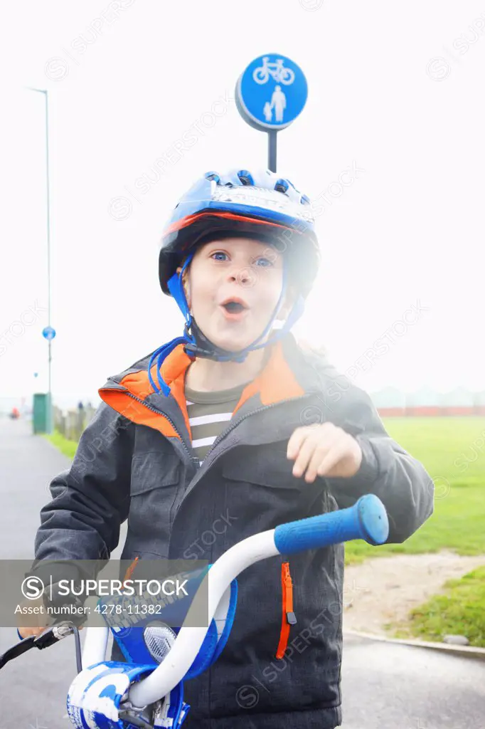 Boy Wearing Helmet Riding Bike