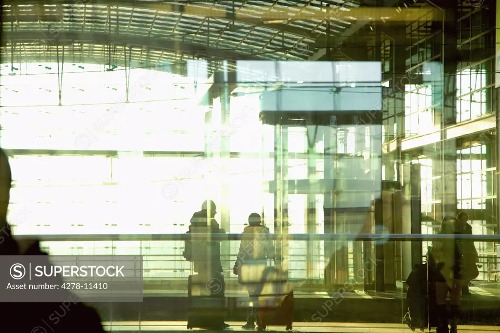 Travellers behind Glass Wall at S-Bahn Station, Berlin, Germany