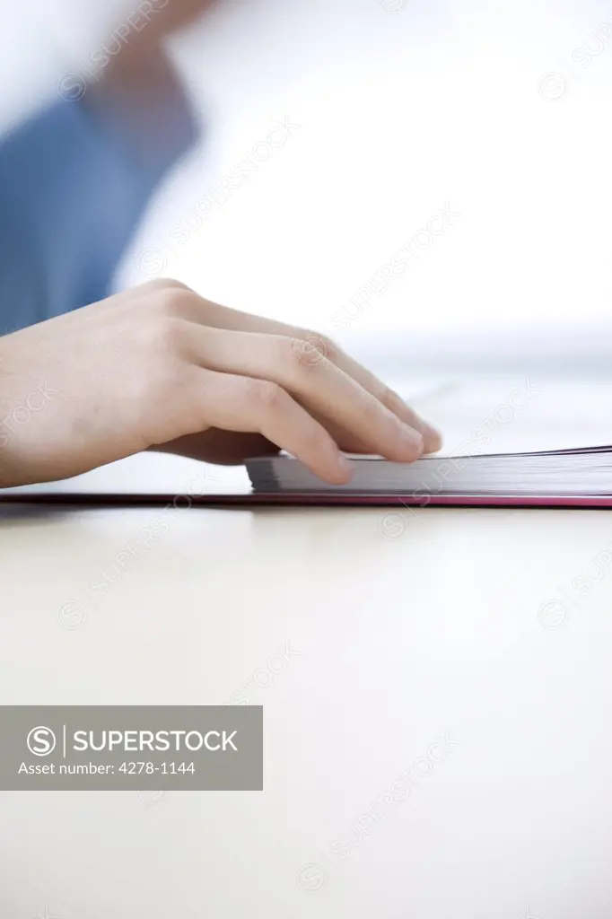 Close up of man's hands checking file