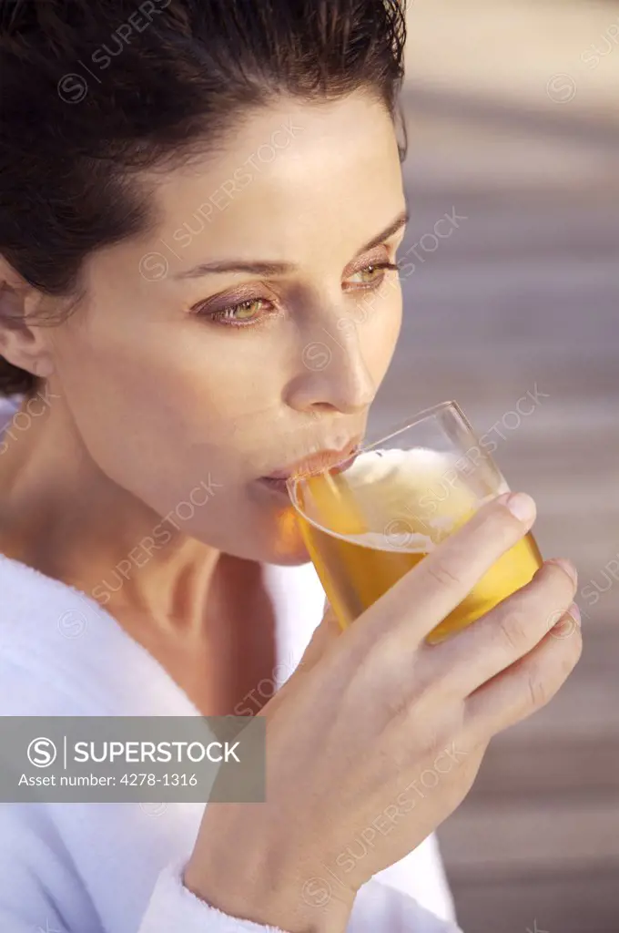 Woman drinking apple juice