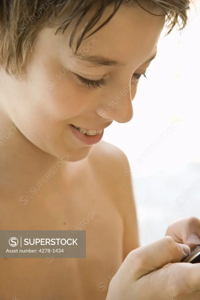 Boy texting on cell phone